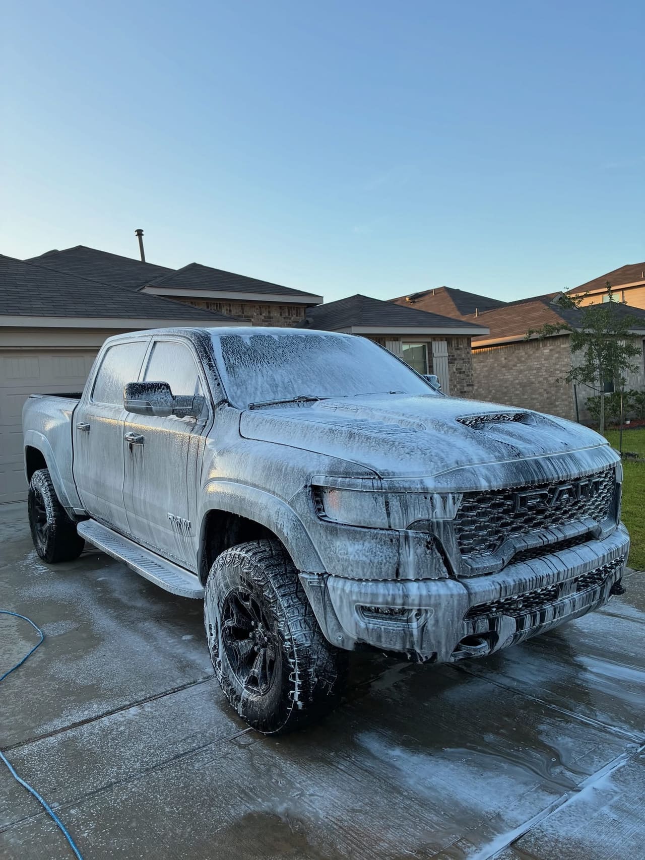 RAM pickup covered in snow foam during the wash